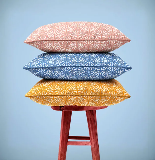 Moji Salehi’s Odyssey Collection of hand-printed home and lifestyle products, including cushions, lampshades, wallpaper, gift wraps, notebooks, and silk scarves, featuring intricate patterns inspired by Persian heritage and contemporary design.
