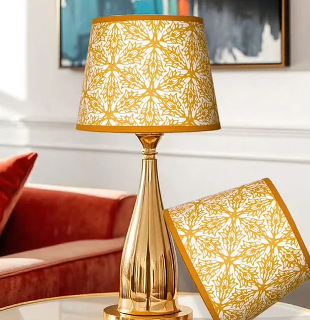 Moji Salehi’s Odyssey Collection of hand-printed home and lifestyle products, including cushions, lampshades, wallpaper, gift wraps, notebooks, and silk scarves, featuring intricate patterns inspired by Persian heritage and contemporary design.