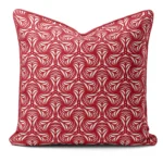 Hand-printed red petal cushion, organic fabric