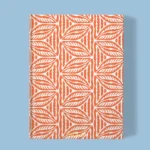 Hand-printed orange Cottage Leaves notebook, organic fabric